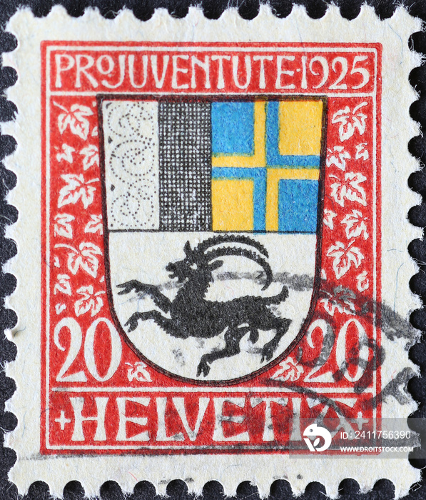Switzerland - Circa 1925: a postage stamp printed in the Switzerland showing a coat of arms with ibex of the Swiss canton of Grisons on a charity postal stamp