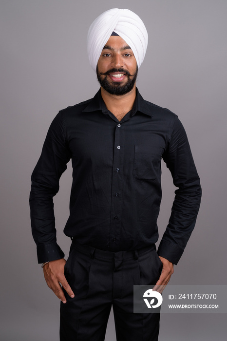 Young Indian Sikh businessman wearing white turban