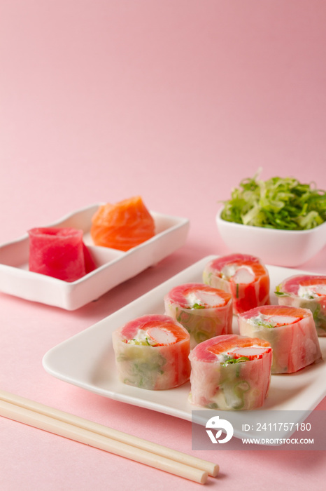 sushi, sushi salad, pink background. japanese food