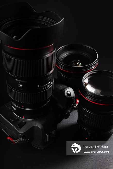 Professional mirrorless camera with premium lenses in dark background