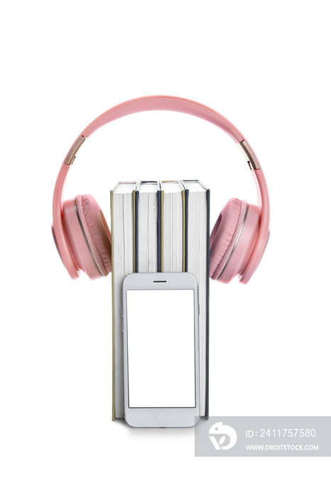 Modern headphones, mobile phone and books on white background