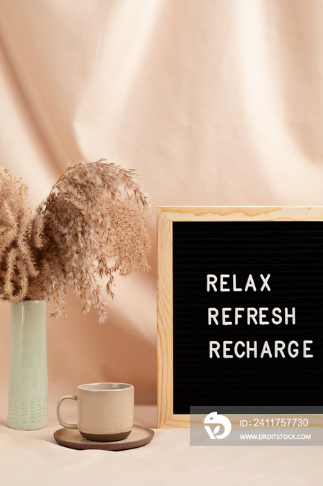 Relax, refresh, recharge, motivational quote on letter board