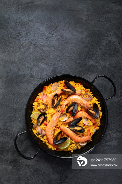 Seafood Paella on gray background.