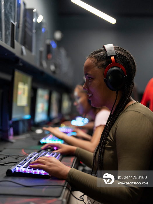 Friends playing video games in gaming club