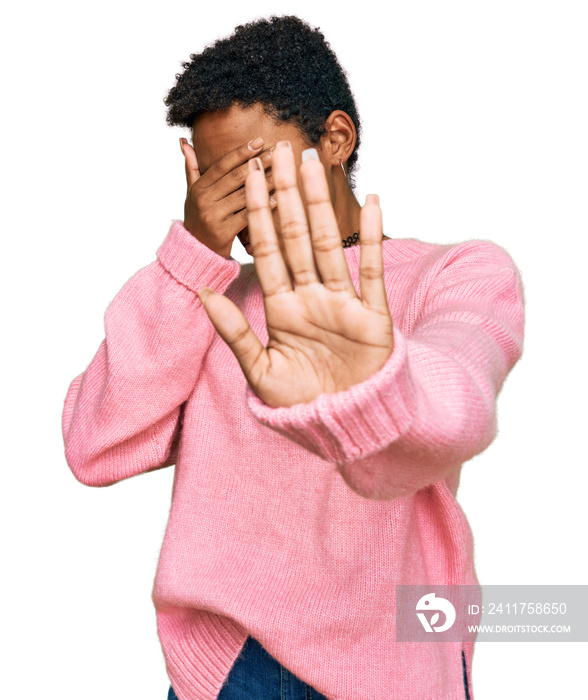 Young african american woman wearing casual clothes covering eyes with hands and doing stop gesture with sad and fear expression. embarrassed and negative concept.