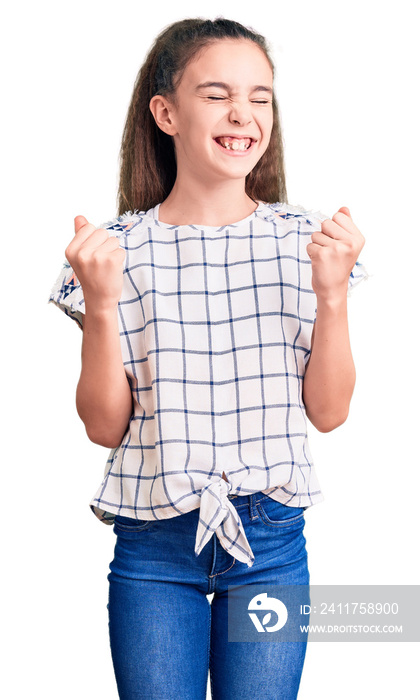 Cute hispanic child girl wearing casual clothes very happy and excited doing winner gesture with arms raised, smiling and screaming for success. celebration concept.