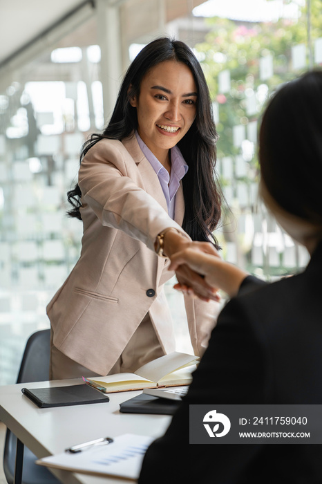 Business partnership meeting concept. Image businessman s handshake. Successful businesswomen handshaking after a good deal.