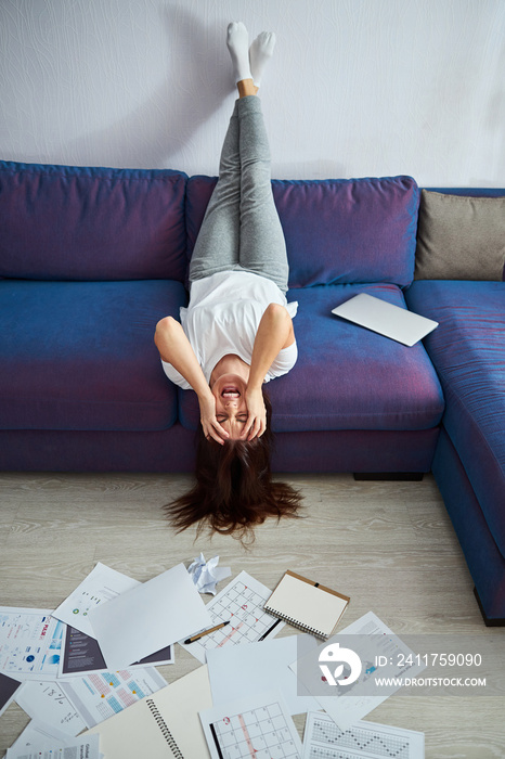 Young woman tired of working indoors during quarantine