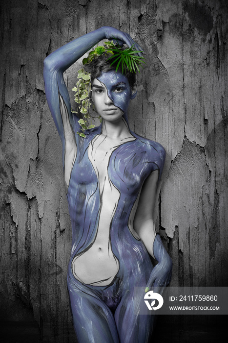 Studio portrait of woman painted on body paint