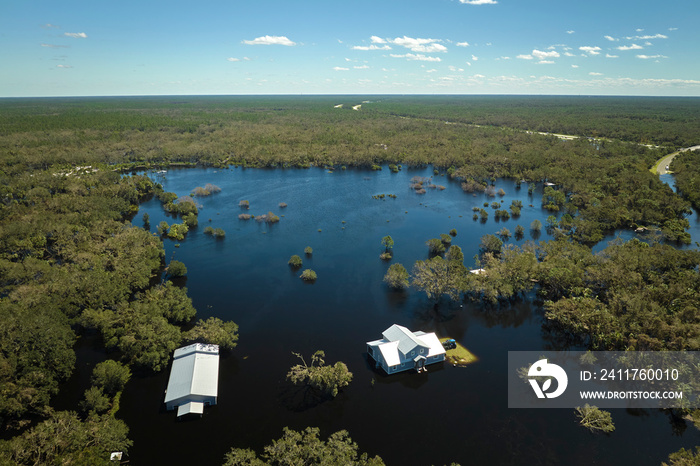 Hurricane Ian flooded houses in Florida residential area. Natural disaster and its consequences