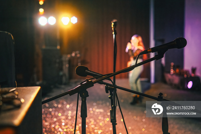 Microphone on a stage waiting for a singer