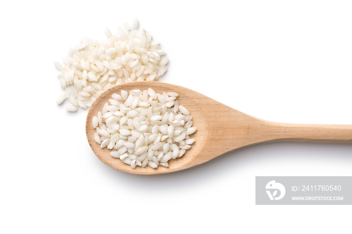 The arborio rice in wooden spoon.