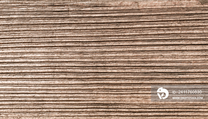 Image of brushed wooden board. Cool dark grunge wood grain texture background. Top view of brown wood cutting board.