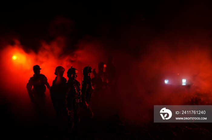 Anti-riot police give signal to be ready. Government power concept. Police in action. Smoke on a dark background with lights. Blue red flashing sirens.