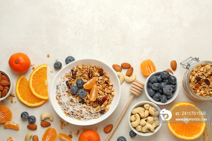 Concept of tasty breakfast with granola on white background