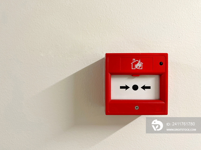 Bright red fire alarm test with light shadow isolated on white background. safety concept.