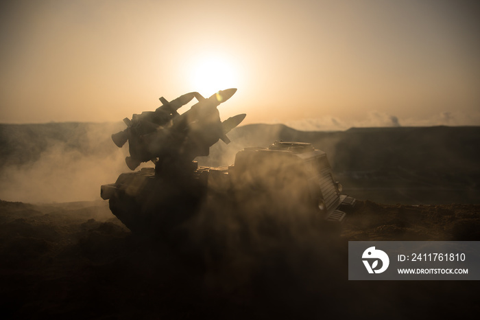 War concept. Battle scene with rocket launcher aimed at gloomy sky at sunset time. Rocket vehicle ready to attacSelective focus