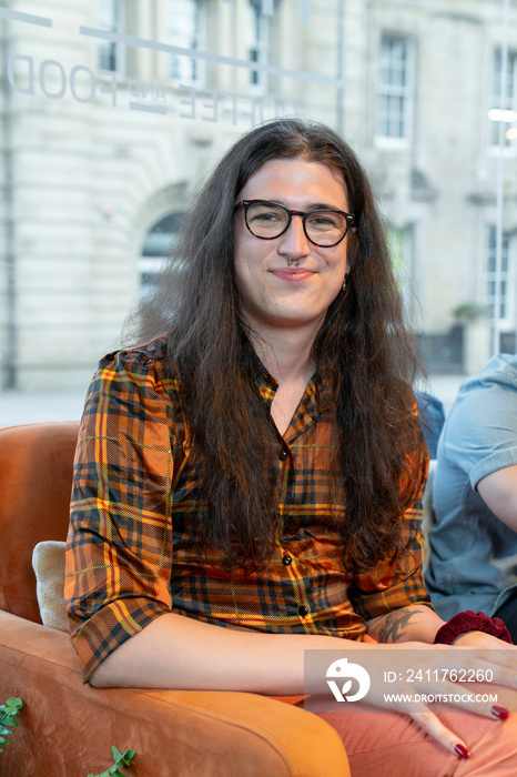 Portrait of young businessman sitting in office