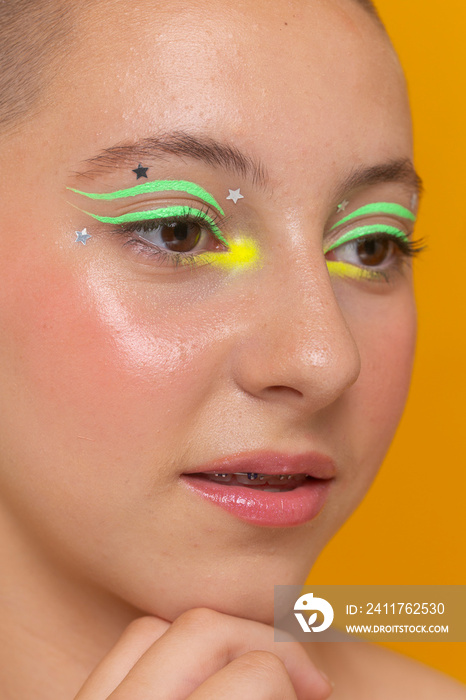 Close-up of girl with neon colored make-up