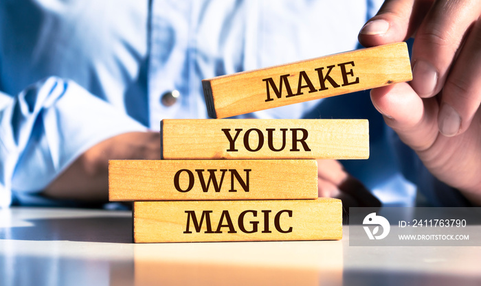 Wooden blocks with words ’Make Your Own Magic’.