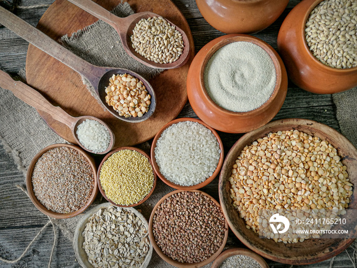 Various groats, cereals. Different types of groats in bowls, close up. Healthy nutrition food