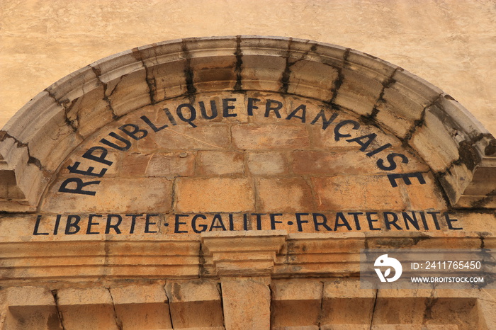 written on a facade: French republic, freedom, equality and fraternity