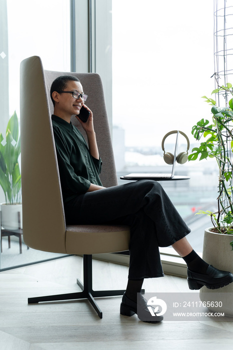 Woman resting in office lobby