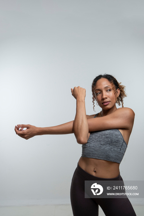 Woman stretching arm