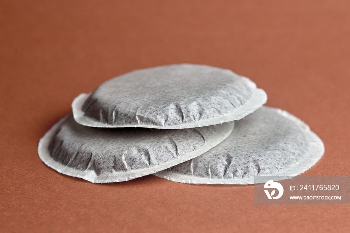 coffee pods on a brown background