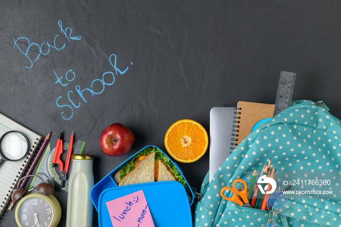 School lunch box and fruit for kids with backpack