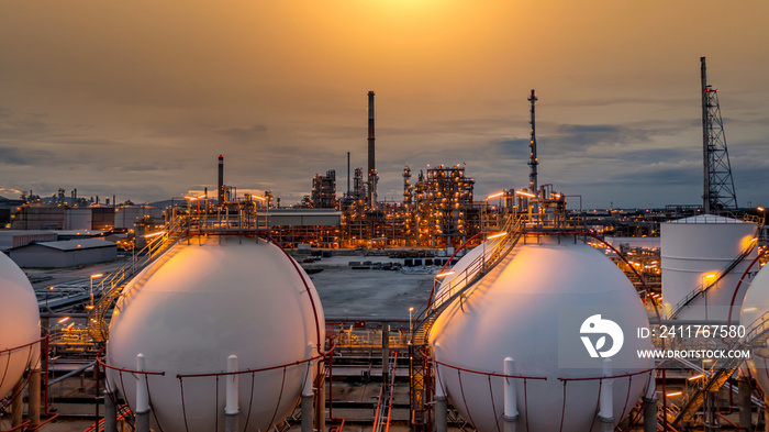 Gas storage sphere tank in petrochemical industry zone with oil and gas refinery factory plant petrochemical industry and oil storage tank background, Oil refinery at twilight.