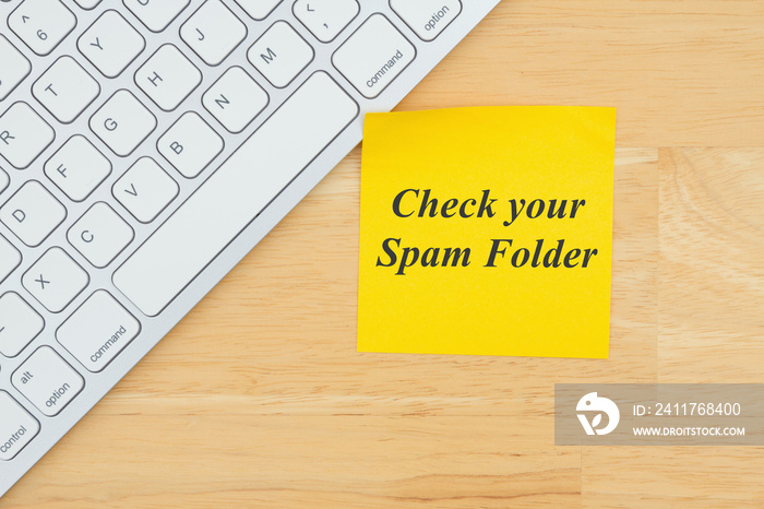 Check your spam folder text on a sticky note with a keyboard