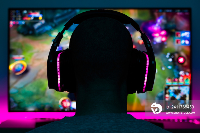 Stock photo of a gamer man playing a video game