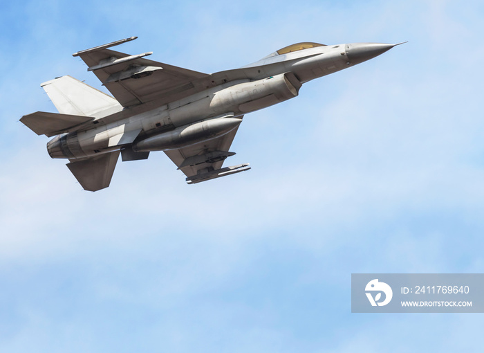 falcon fighter jet military aircraft flying on blue sky background