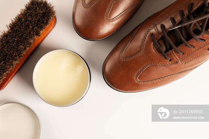 Flat lay , Leather man shoes with shoes cream on white background.