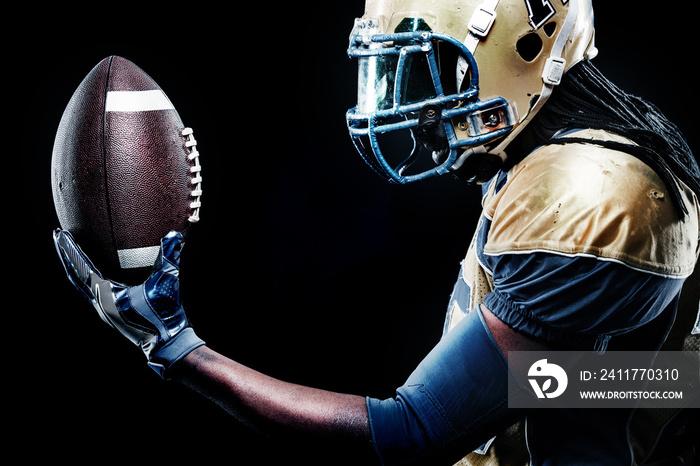 American football sportsman player isolated on black background