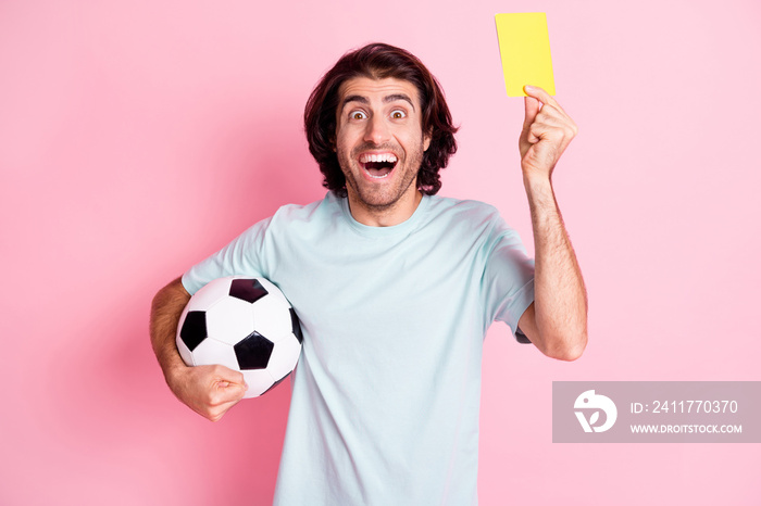 Photo of handsome ref guy hand show yellow card open mouth hold ball isolated on pink color background