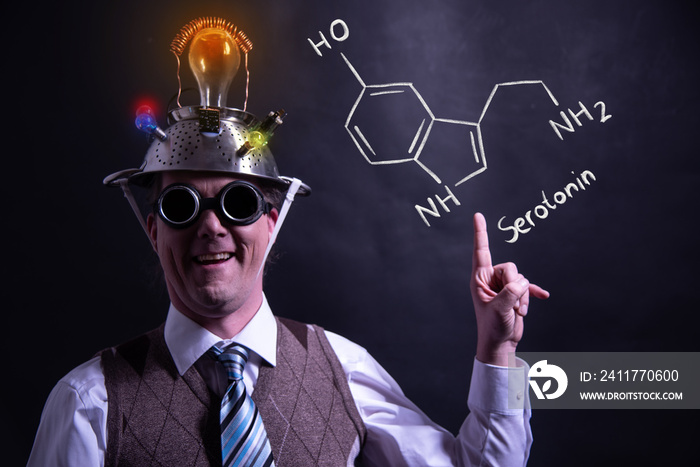 Nerd presenting handdrawn chemical formula of serotonin