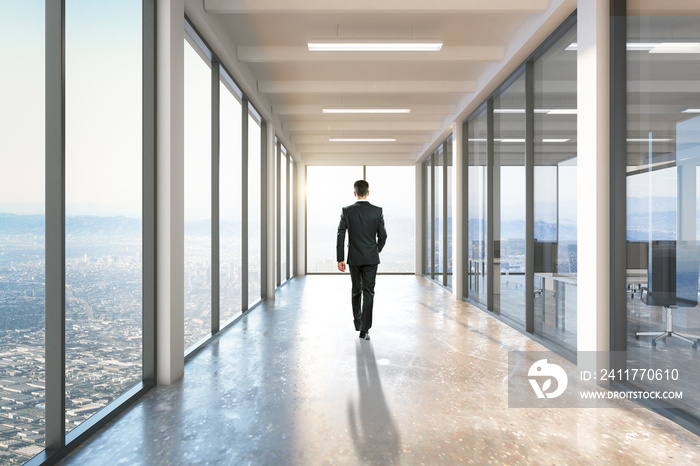 Businessman walking on corridor