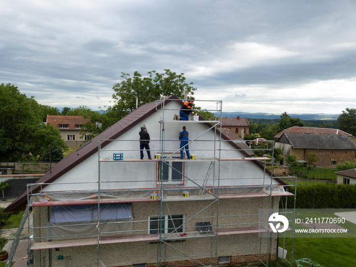 Aerial shot of thermal insulation of the facade of a family house.