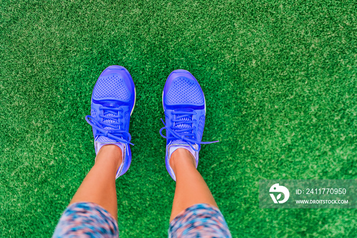 Runnin shoes POV standing selfie girl going walking doing outdoor exercise on grass for weight loss. Summer fitness lifestyle.