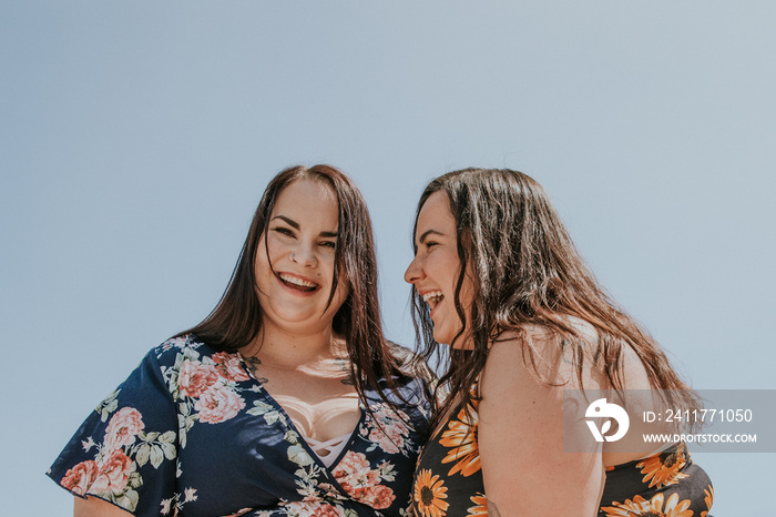 close up of 2 women laughing