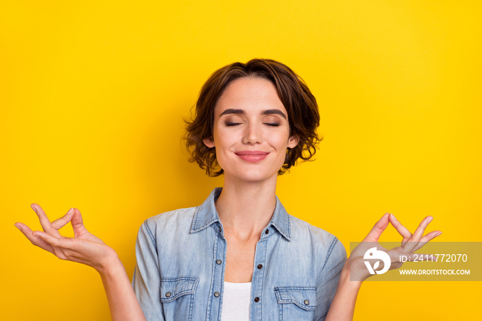 Photo of young pretty woman dreamy meditate rest peaceful imagination isolated over yellow color background