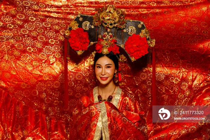 Asian Woman wear China Royal empress traditional costume with golden line design dress and headwear