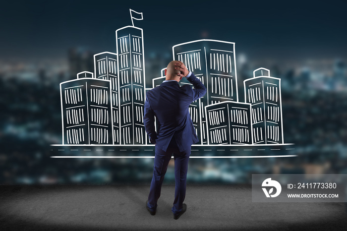 Businessman in front of a wall with Hand drawn city center displayed on a futuristic interface - Travel concept