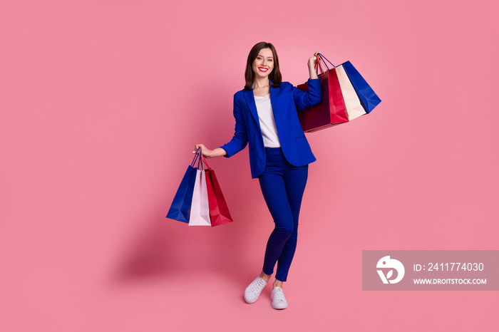 Photo of funny pretty positive lady wear stylish clothes outfit rejoice purchases empty space isolated on pink color background