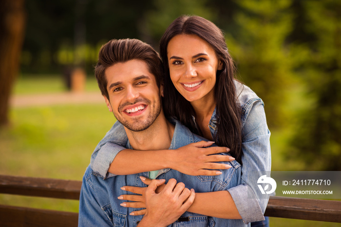 Close-up portrait of his he her she nice attractive lovely peaceful cheerful tender best partners wearing denim spending romance romantic honey moon embracing in green wood forest