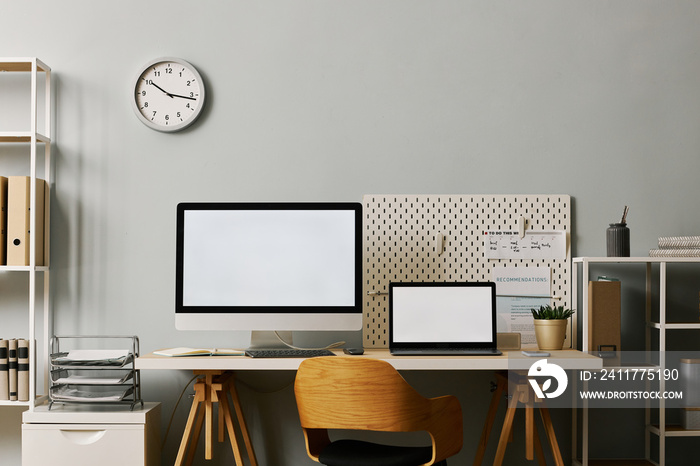 Modern office workplace setup with two screen mockups on desk