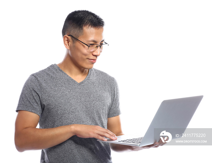 Male Asian programmer with laptop on white background