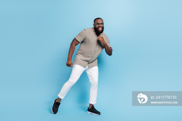 Full length portrait of excited crazy person enjoy dancing chilling isolated on blue color background